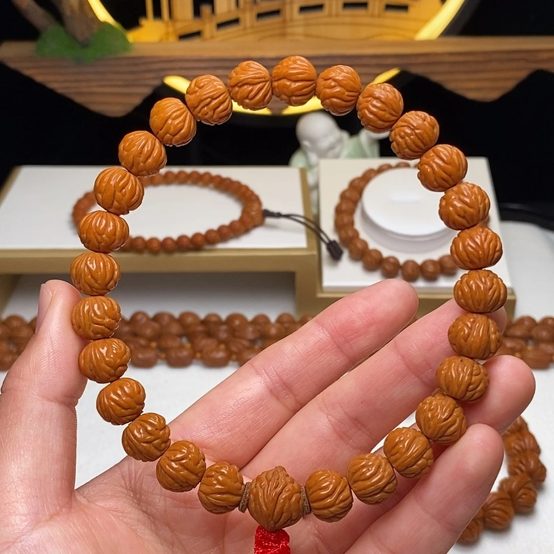 奉***胖桃核手串11mm野生凤羽聚宝盆手持27颗