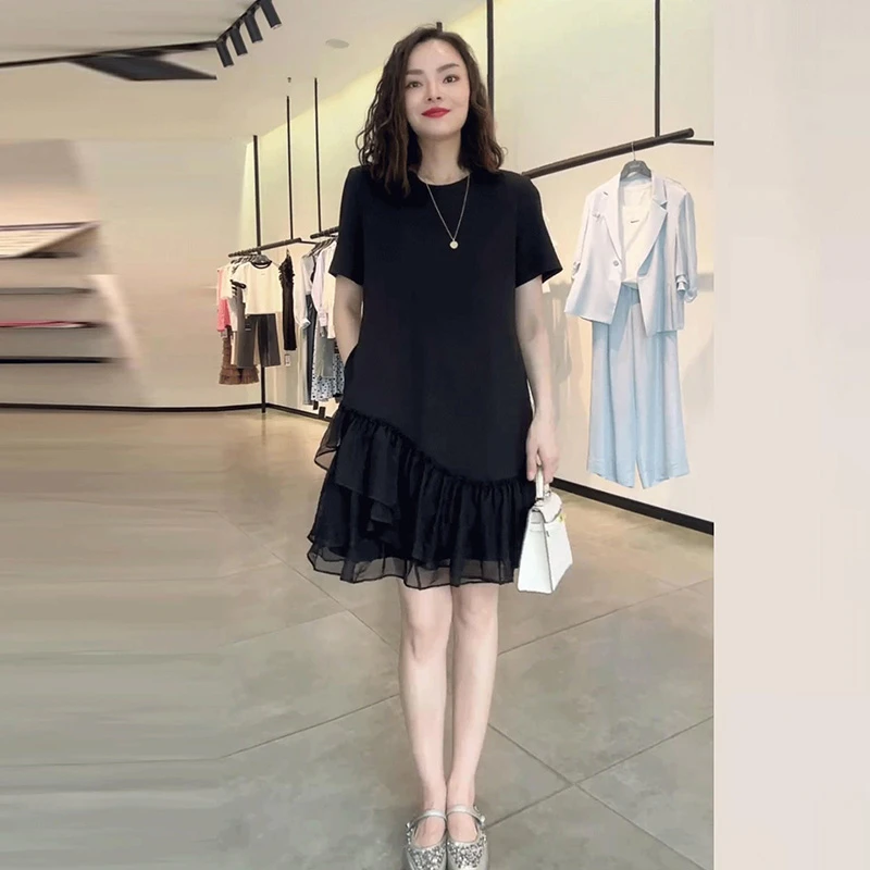 高级感气质休闲中长款拼接黑色连衣裙2025夏季新款宽松显瘦小黑裙