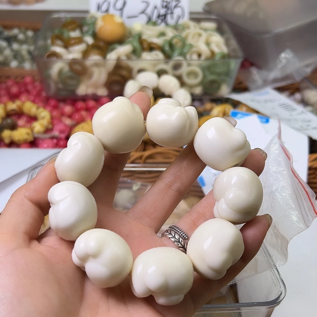 菩提根/象牙果手串瑕疵白爱猫熊爪混1条表面孔道有裂