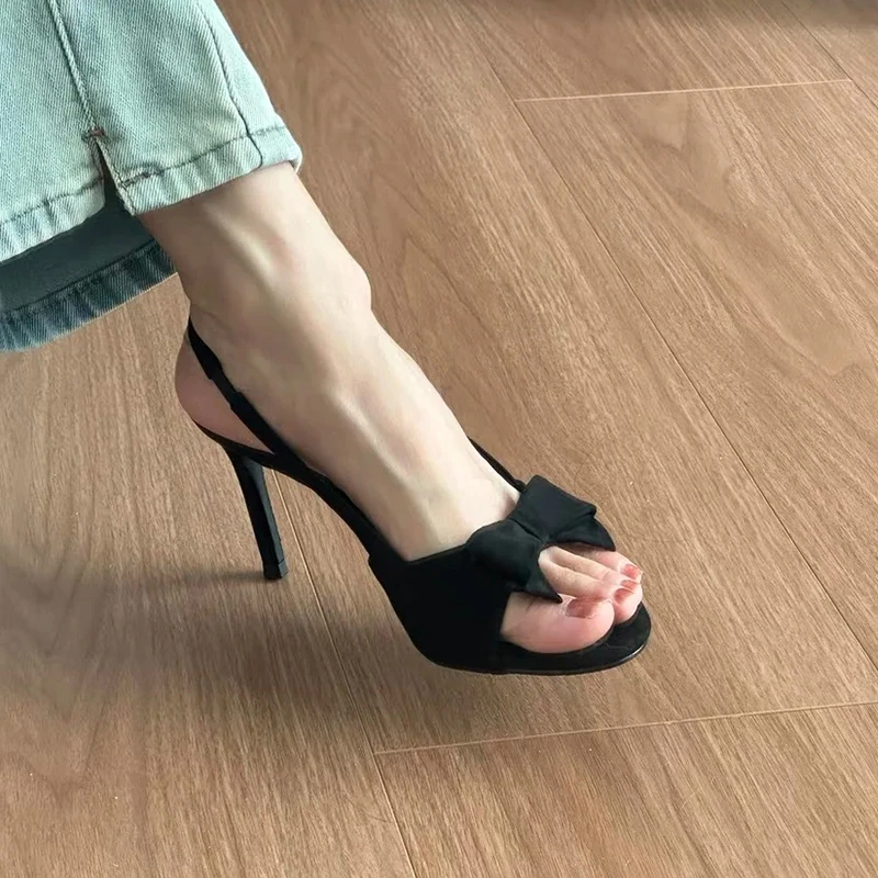 性感蝴蝶结细跟凉鞋女2025夏季新款法式一字带黑色高跟鞋百搭气质