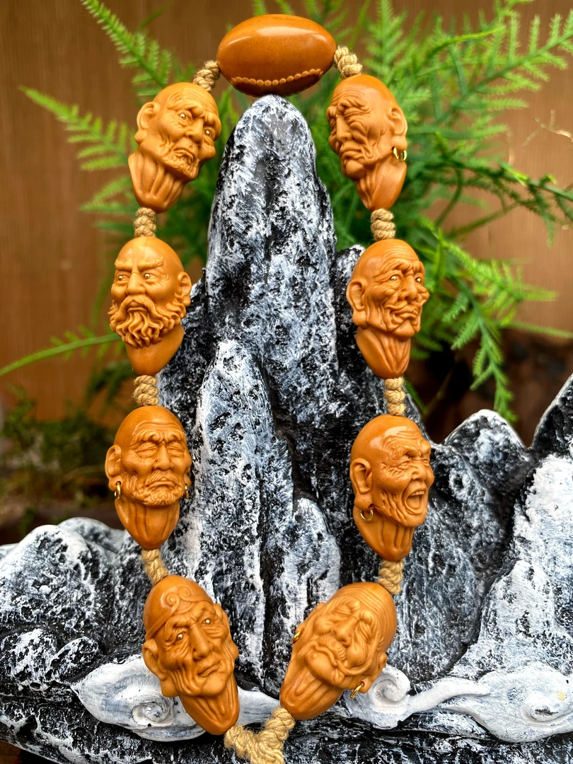 藏艺，八圣罗汉橄榄核雕手持