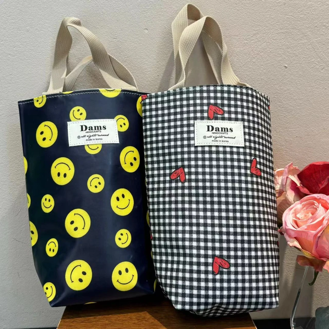 韩系设计款格子笑脸水桶手拎包