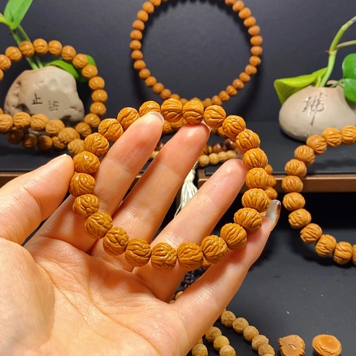 ****桃核手串野生凤羽手串