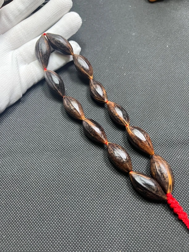 原生态紫皮梅林大榄橄榄核雕老料手持14*30