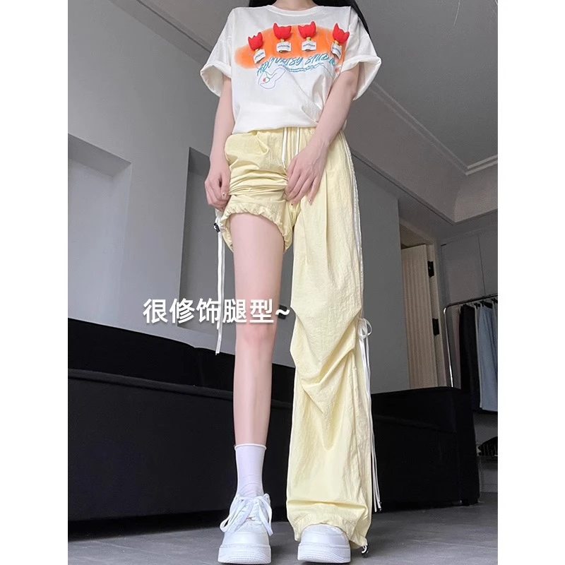 蝴蝶结奶黄色工装裤女夏季2025新款条纹运动伞兵裤韩系甜美阔腿裤