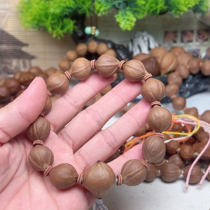 我***贝吊坠橄榄核1518素