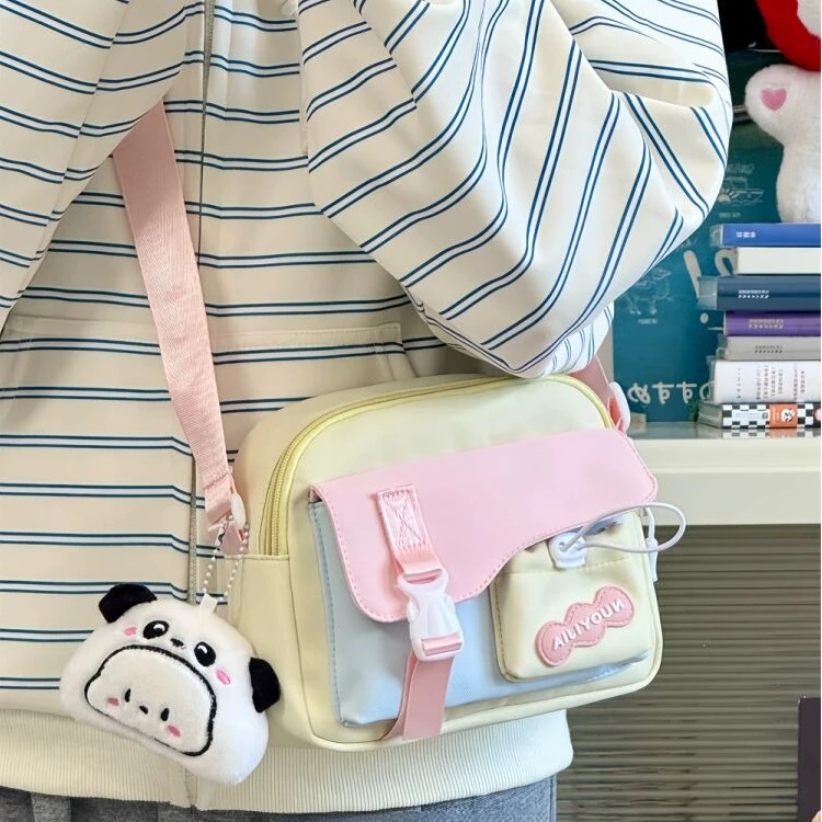 日系甜美尼龙布包包女2025新款潮元气少女学生手机包小清新斜挎FF