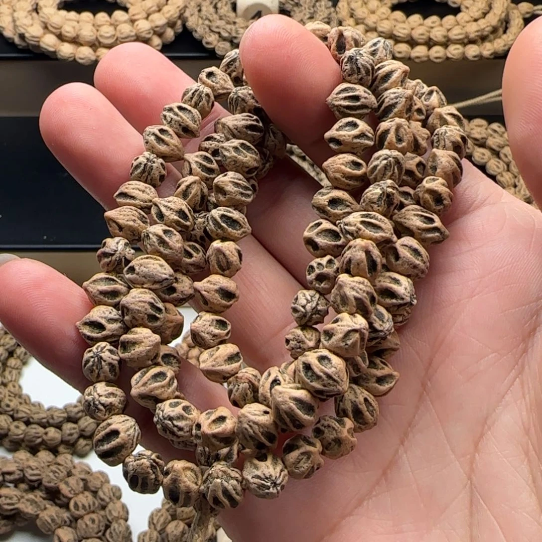 吊坠柏香籽/百香籽游****?横打尸陀林鬼脸