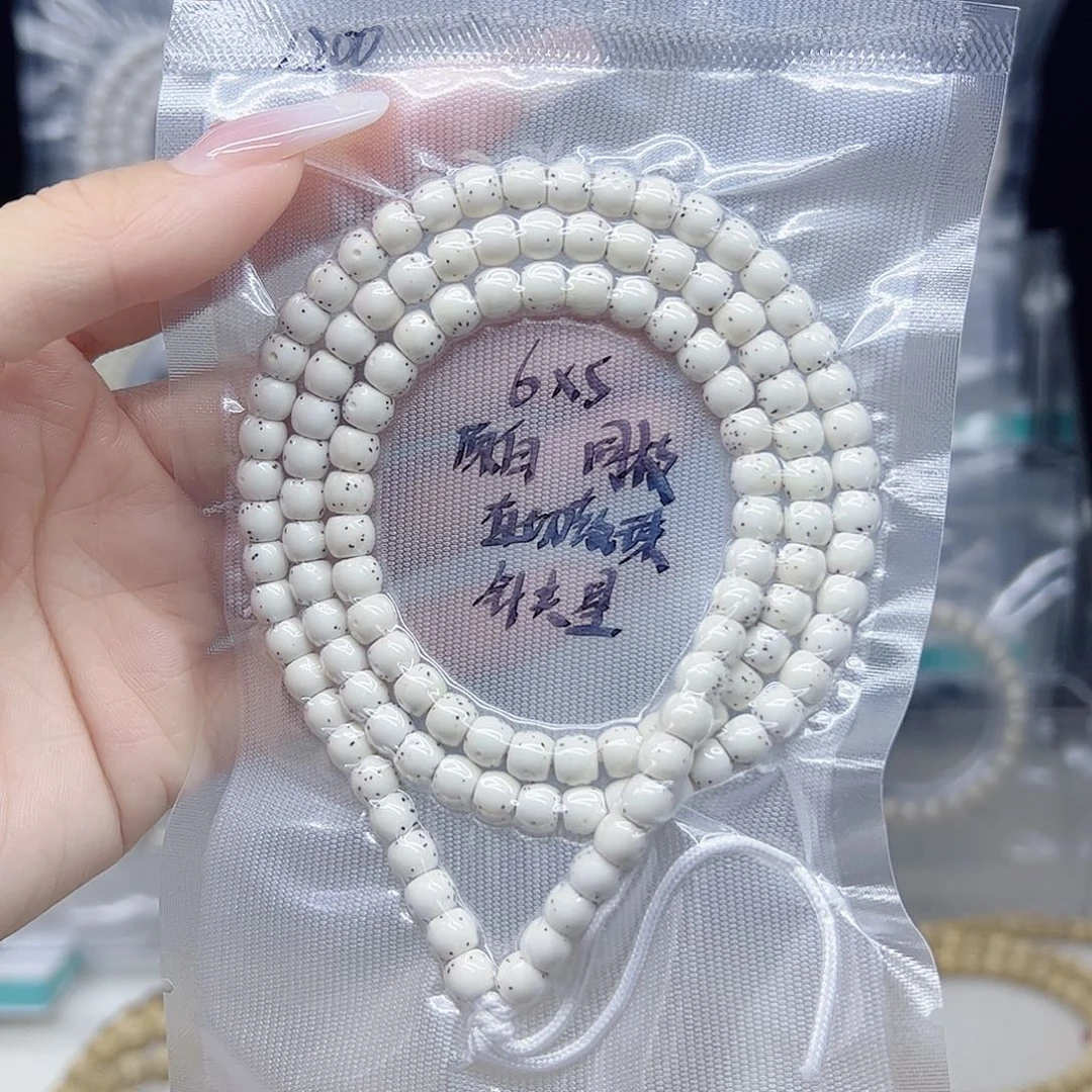 星月菩提手串原白6*5直切鼓珠半壁针尖星