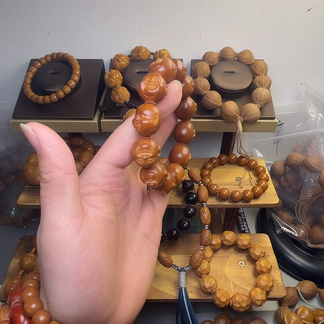 岁***i橄榄核手串/手链1.9铁核十分开心 微花