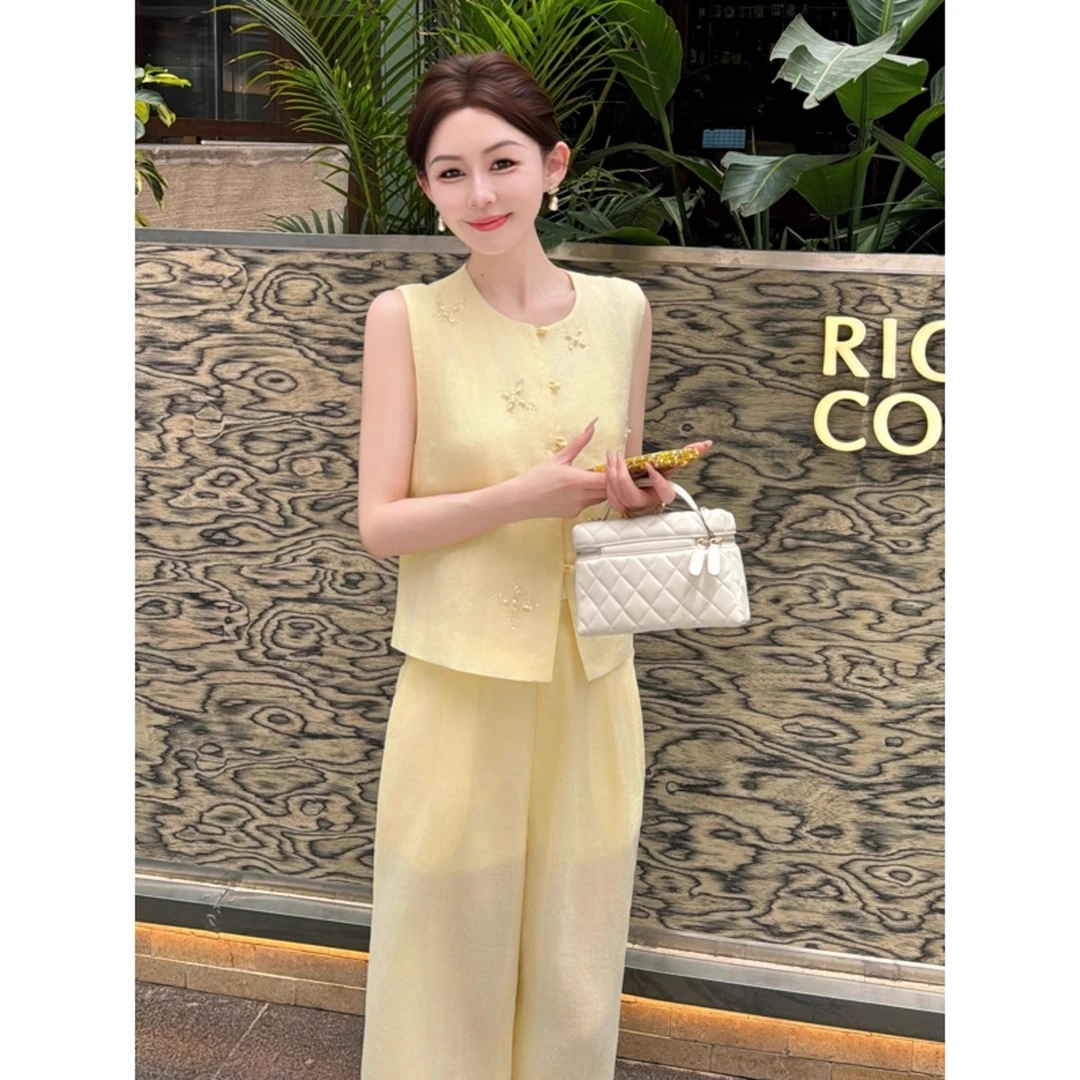 茶里茶气独特温柔风套装女夏绝美气质小香风黄色上衣阔腿裤两件套
