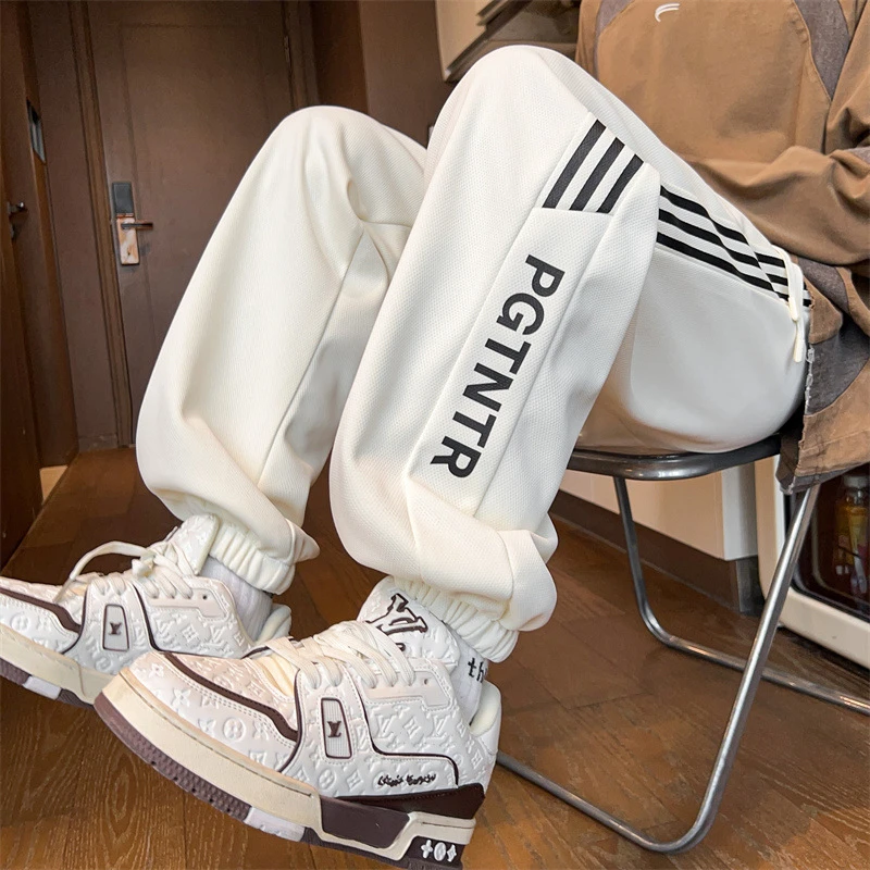 秋季潮流百搭印花哈伦裤子男宽松大码束脚美男士170胖子男生裤子