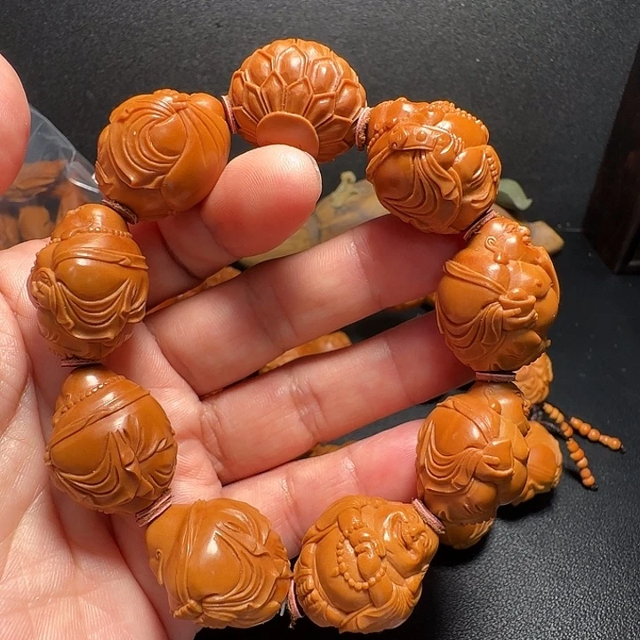 大***伴橄榄核吊坠八宝弥勒