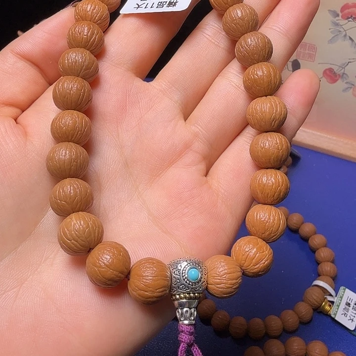 陈***伦猴头核桃手串凤羽