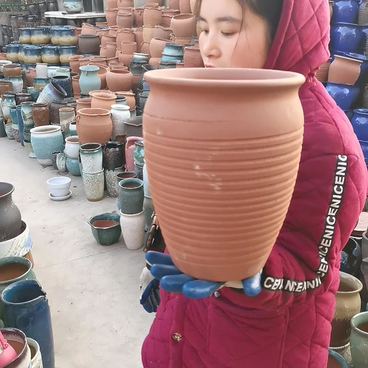 红陶口20高27瑕疵底部烧裂