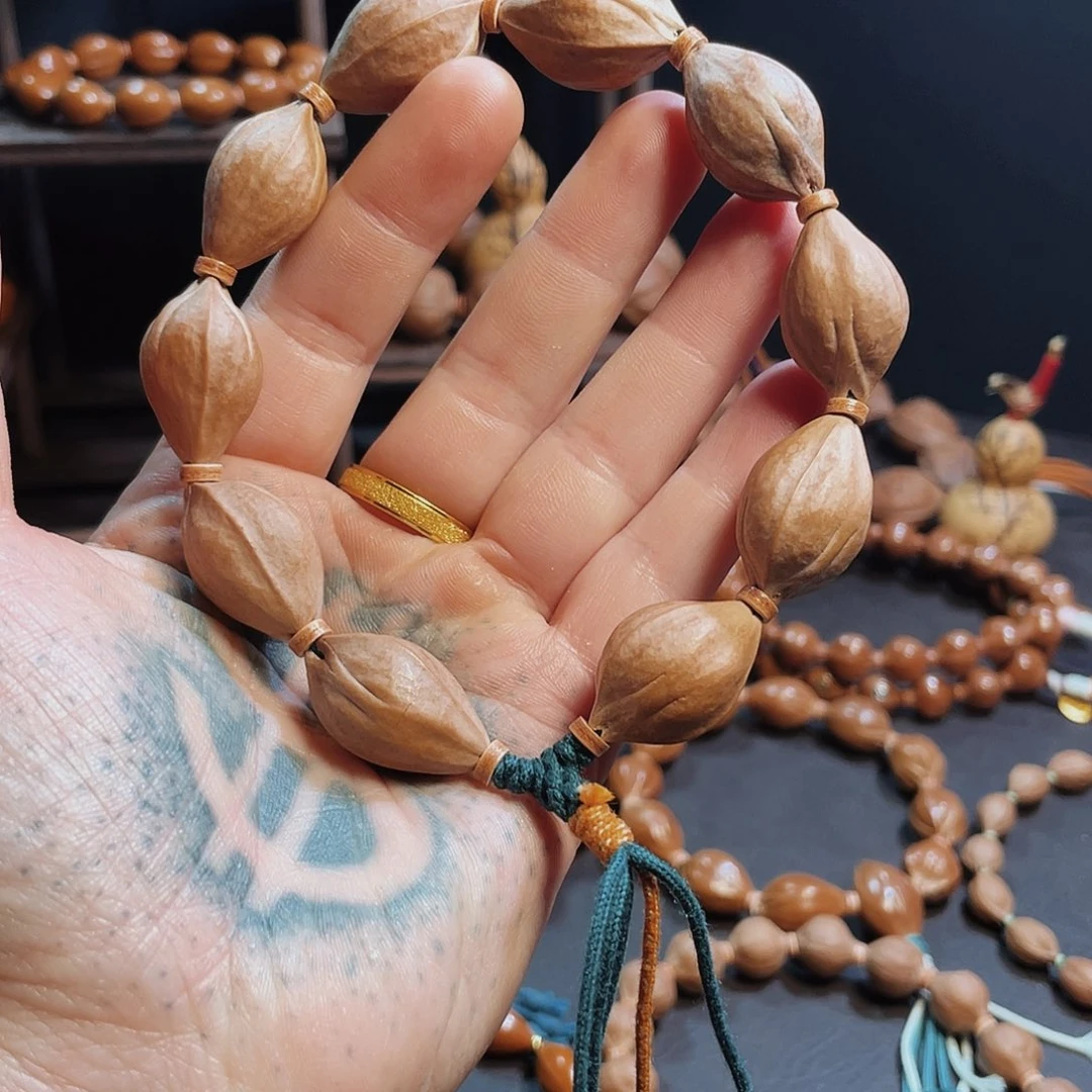 利***民橄榄核手串/手链1.5*2.4铁核三面佛