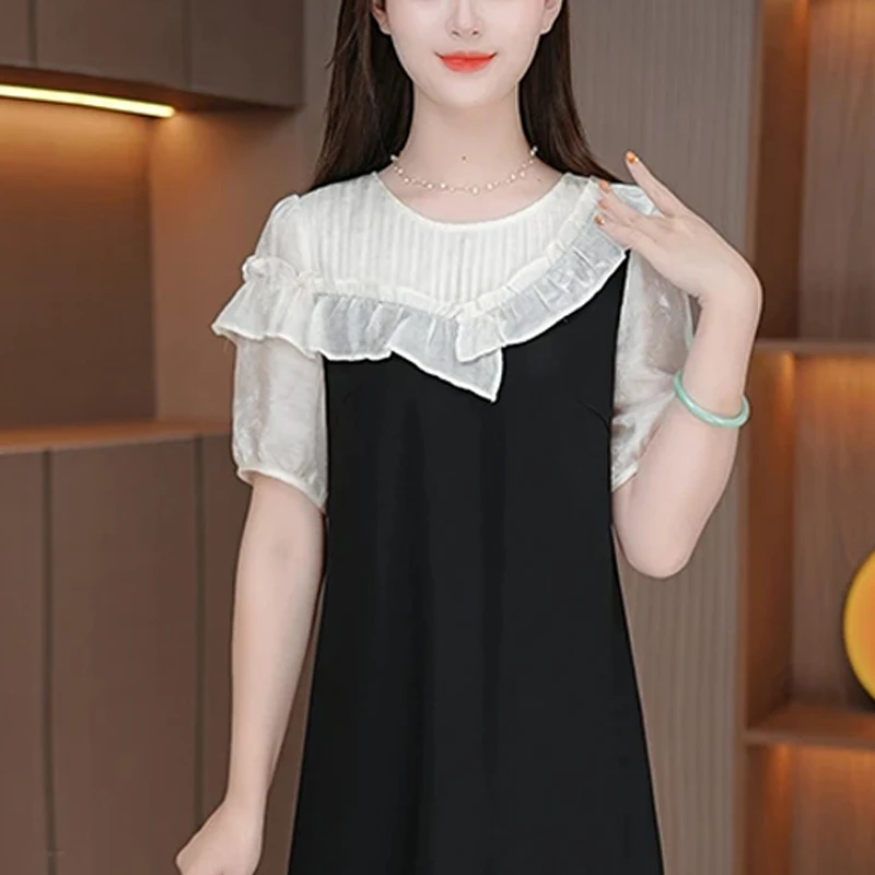 2025夏季新款花边设计感连衣裙女时尚气质拼色显瘦黑裙中长款裙子