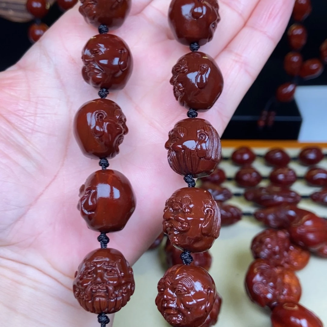 石***头橄榄核吊坠罗汉手持