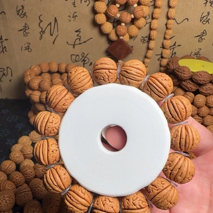 桃核吊坠金鱼肚手串