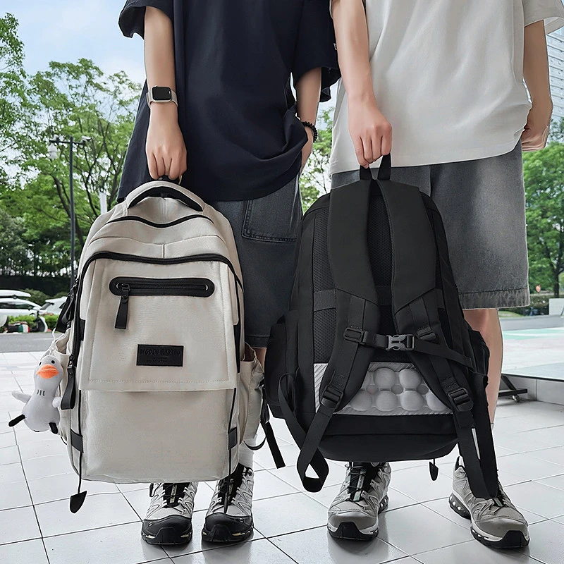 书包男生初中生大容量休闲简约旅行高中生背包减负小学生双肩包女