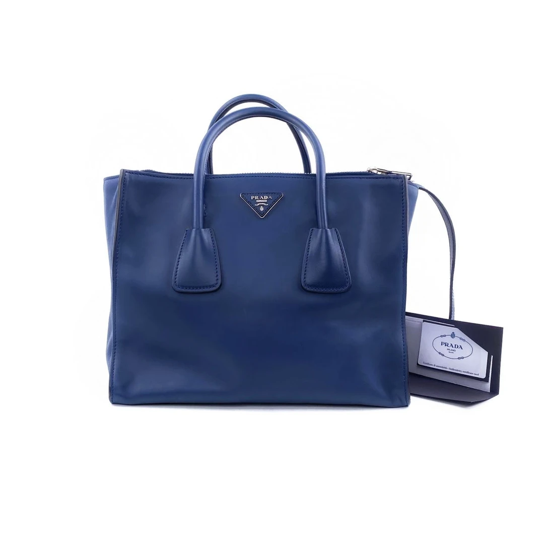 95新 Prada/普拉达 蓝色牛皮银标手提单肩包