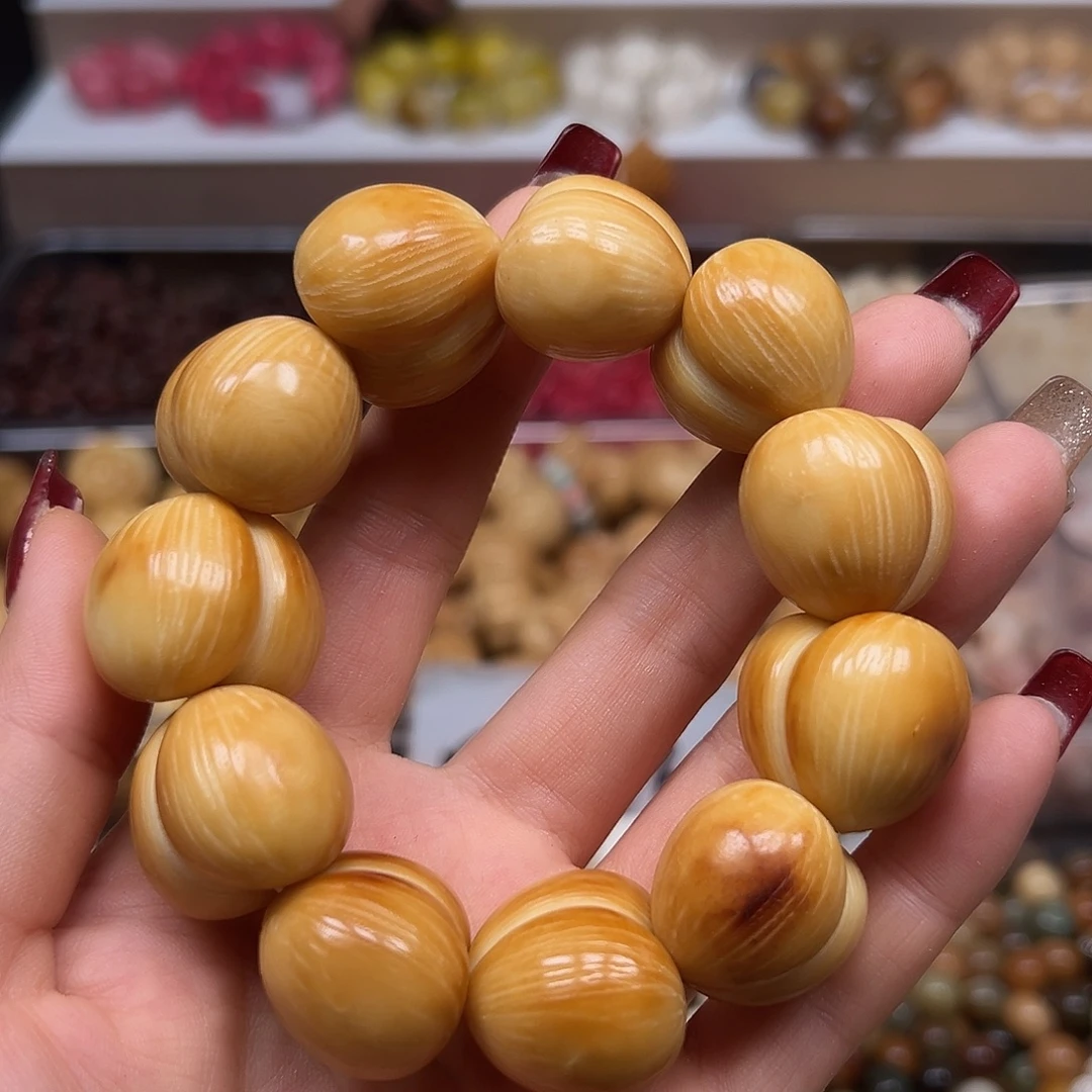 手串菩提根/象牙果瑕疵炭烤拉丝屁桃1条上下孔表面有裂