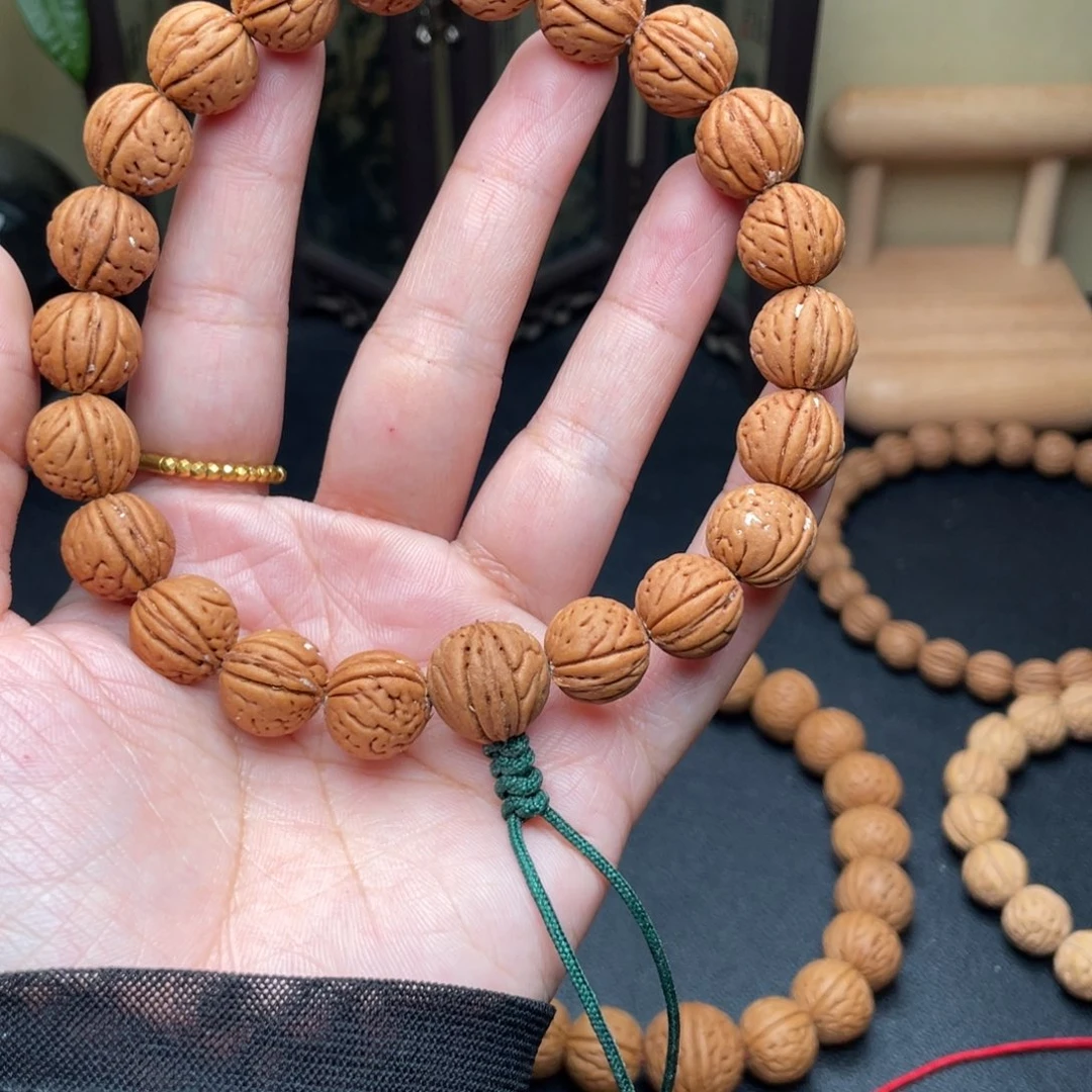 -****12加野生红皮桃核手持