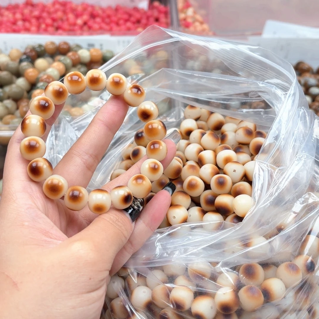 白玉菩提吊坠a12mm50颗。眼睛