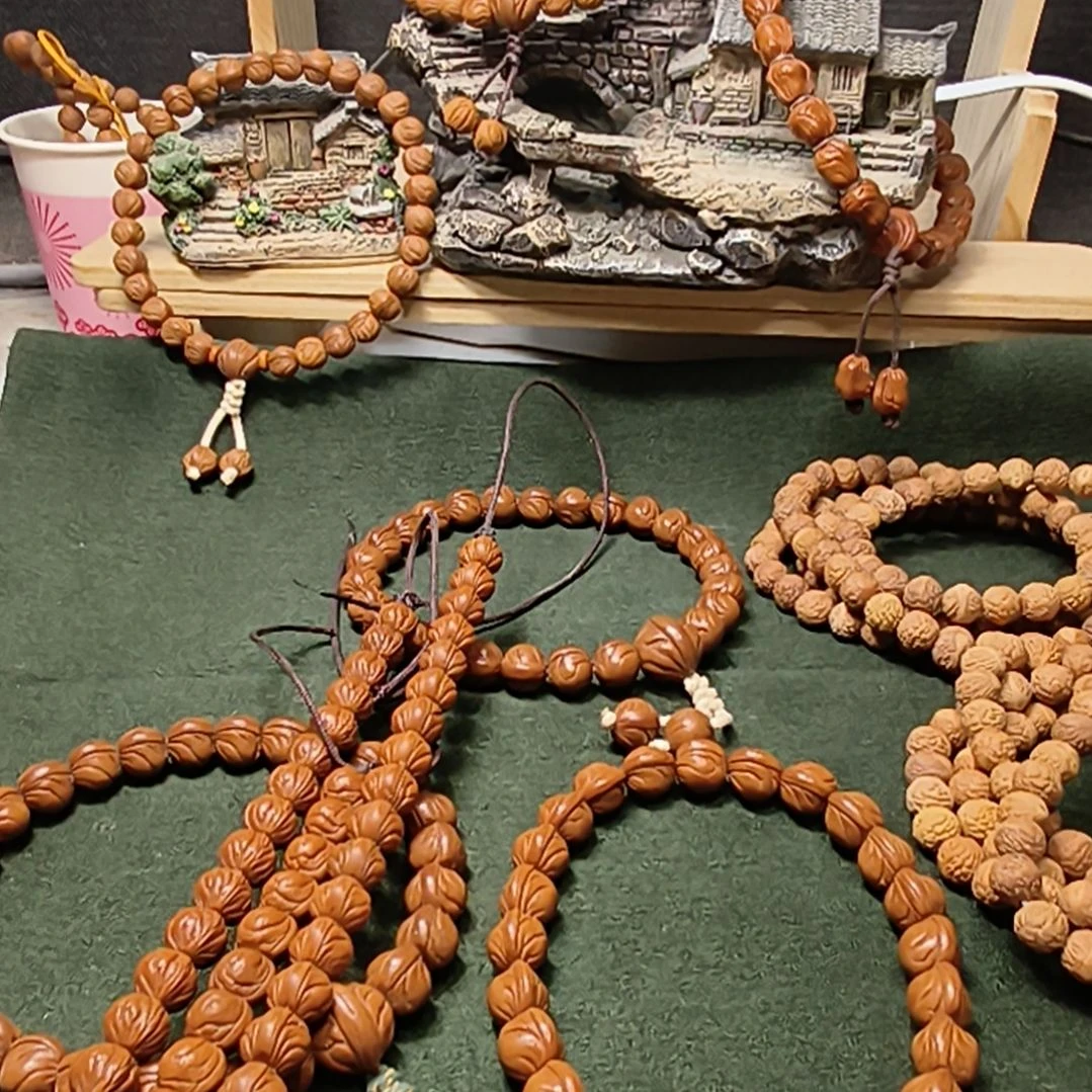 蒜***马吊坠桃核陕西秦岭龙纹桃核手串