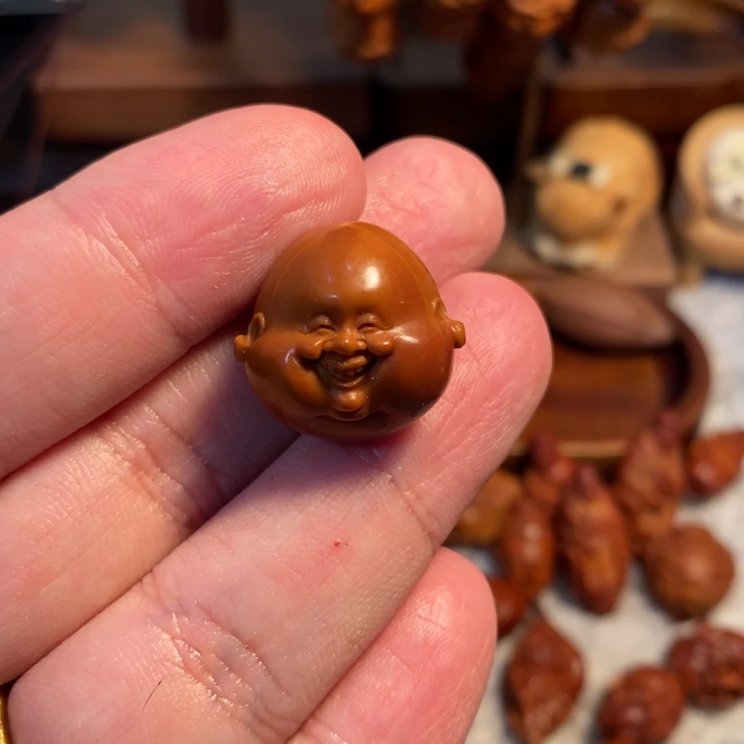 沧***粟手串橄榄核2.15铁核微包浆金思成笑佛头单籽