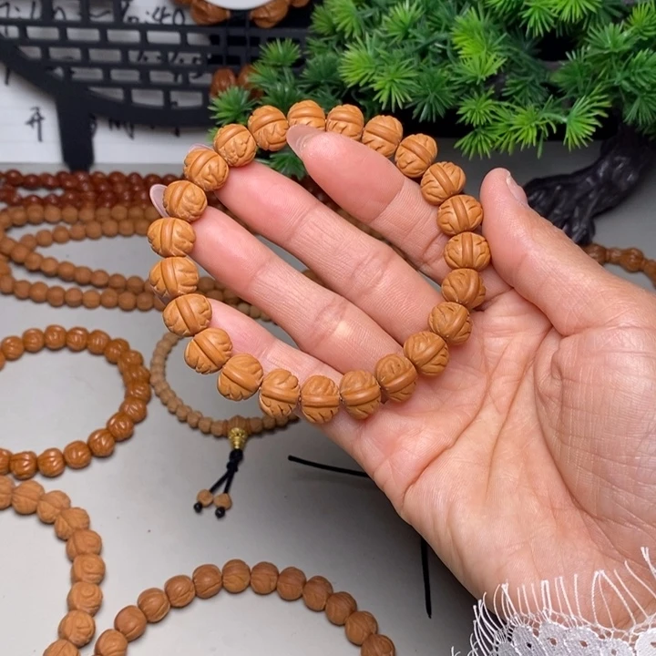 手串桃核凤羽聚宝盆