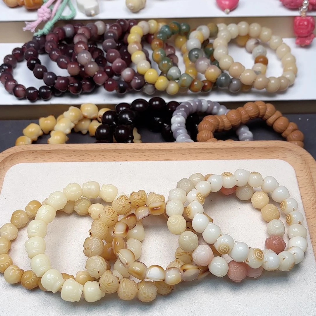 菩提根/象牙果吊坠k10-12mm雕刻手串一条随机