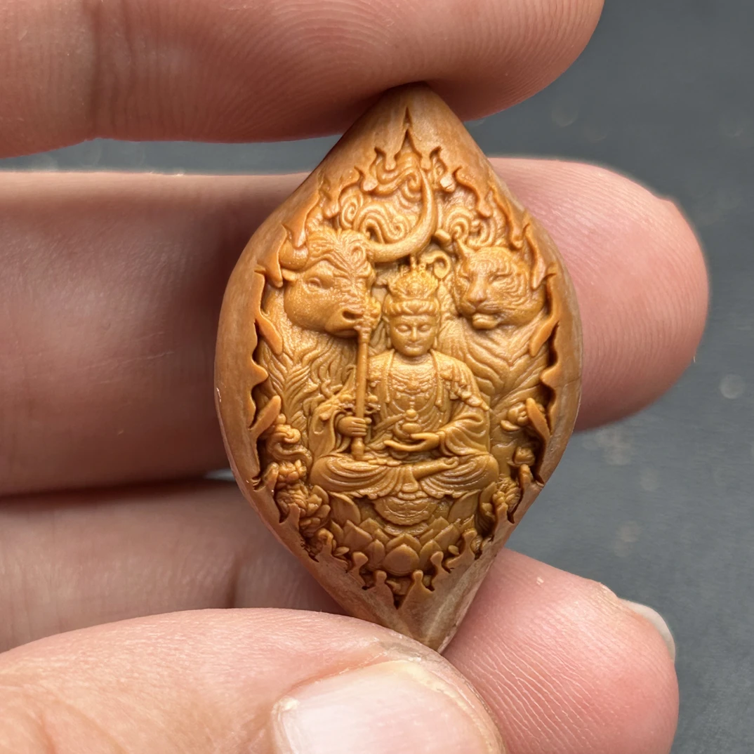 橄榄核雕生肖虎和牛的守护