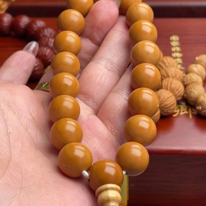橄榄核吊坠猴头手串