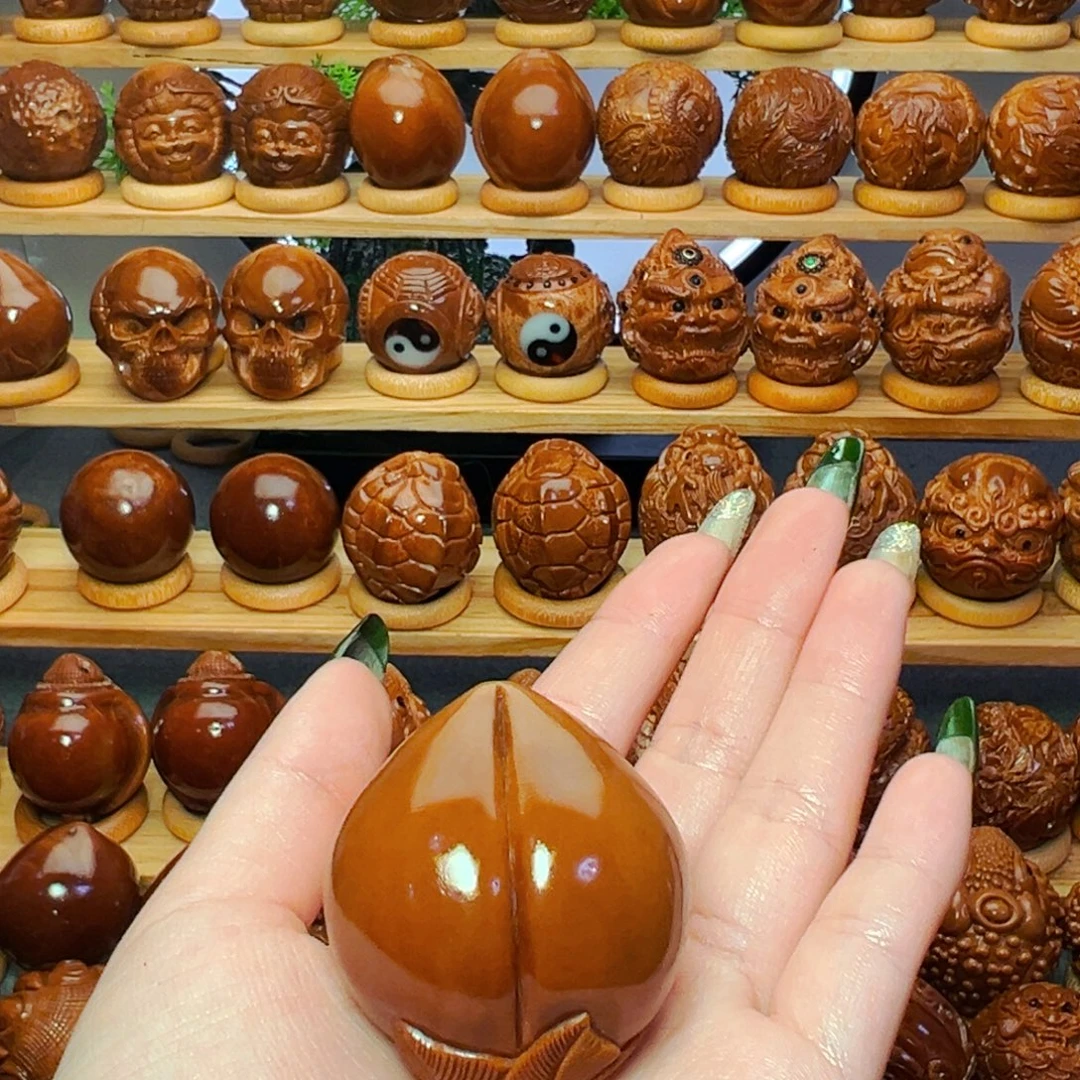 扬***航橄榄核吊坠寿桃111111