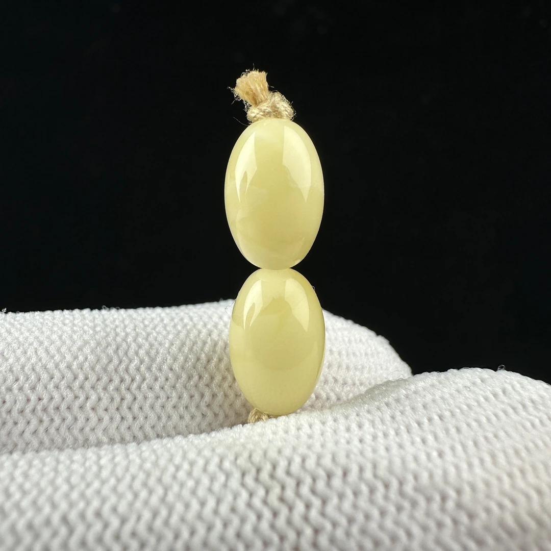 K2599天然原矿蜜蜡 对珠7mm支持复检假一罚十