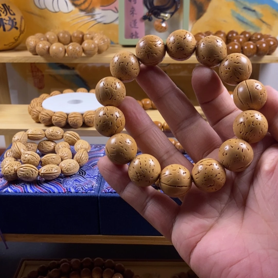 重****桃核吊坠沈阳脑纹正圆光珠