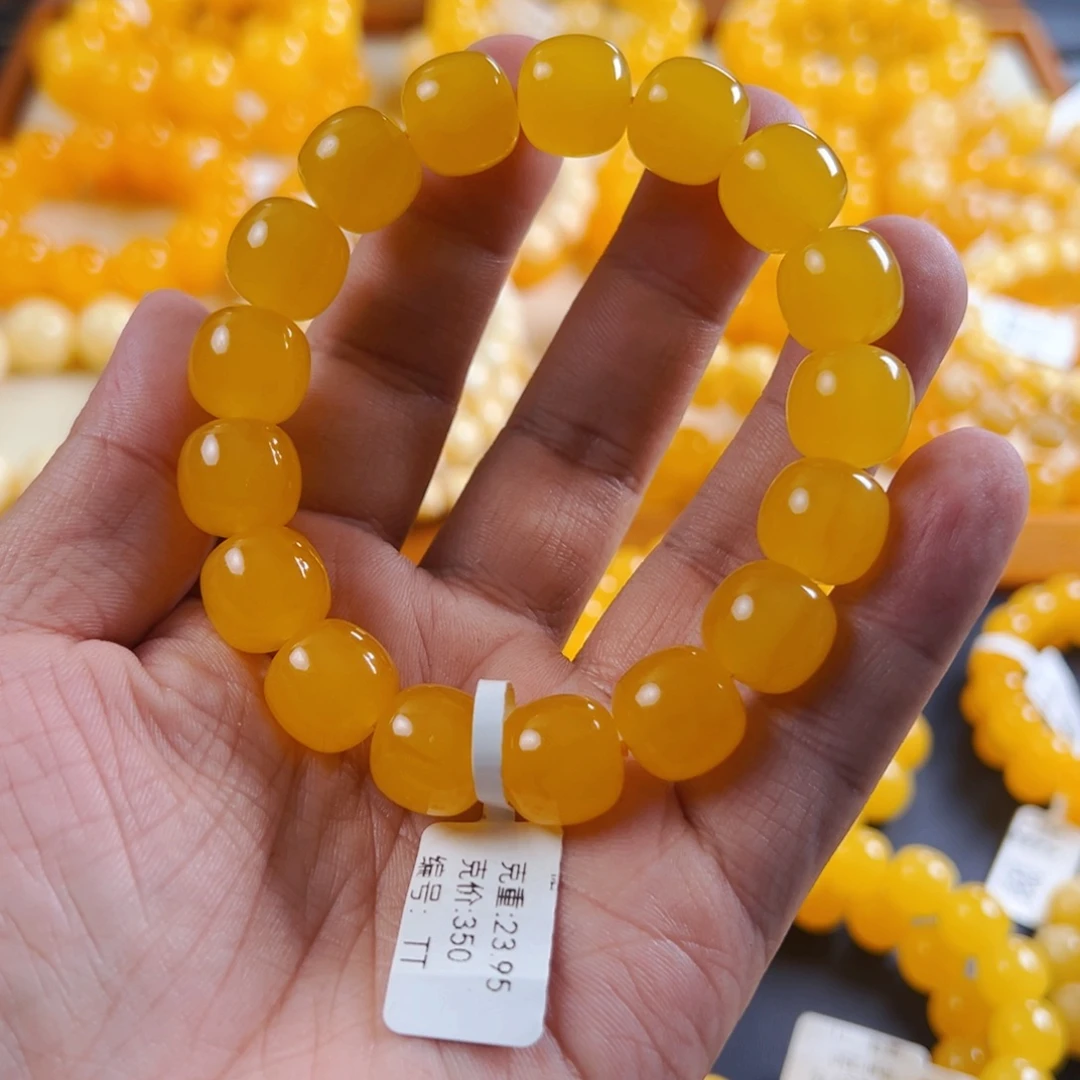 琥珀未镶嵌手串13 m焦皮橘色克重23.95TT