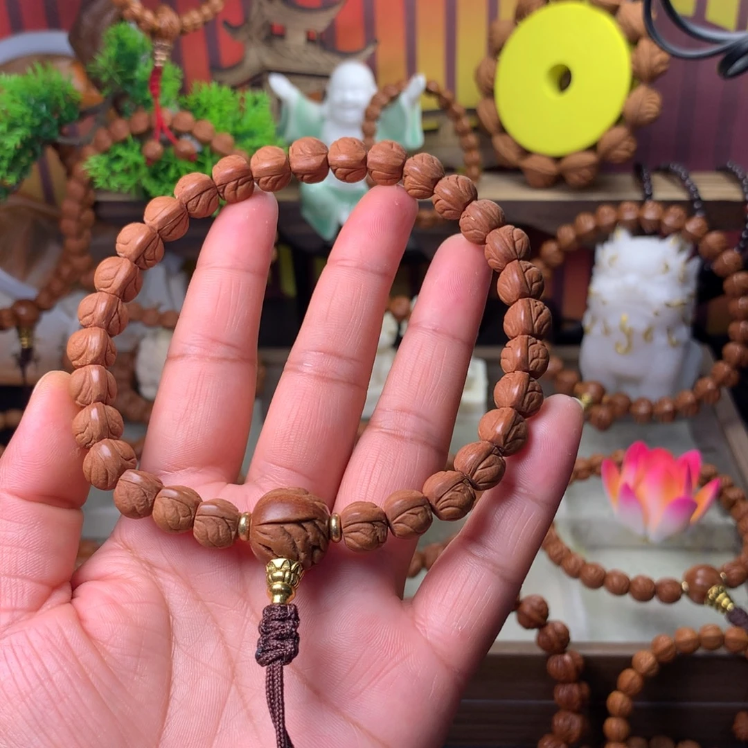 闪***蟹桃核吊坠玉龙脊手持10