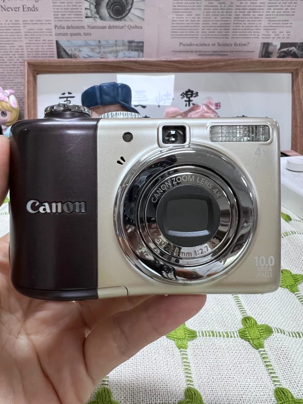 95新 Canon/佳能 A1000IS1000万像素4倍变焦香槟复古面包机相机