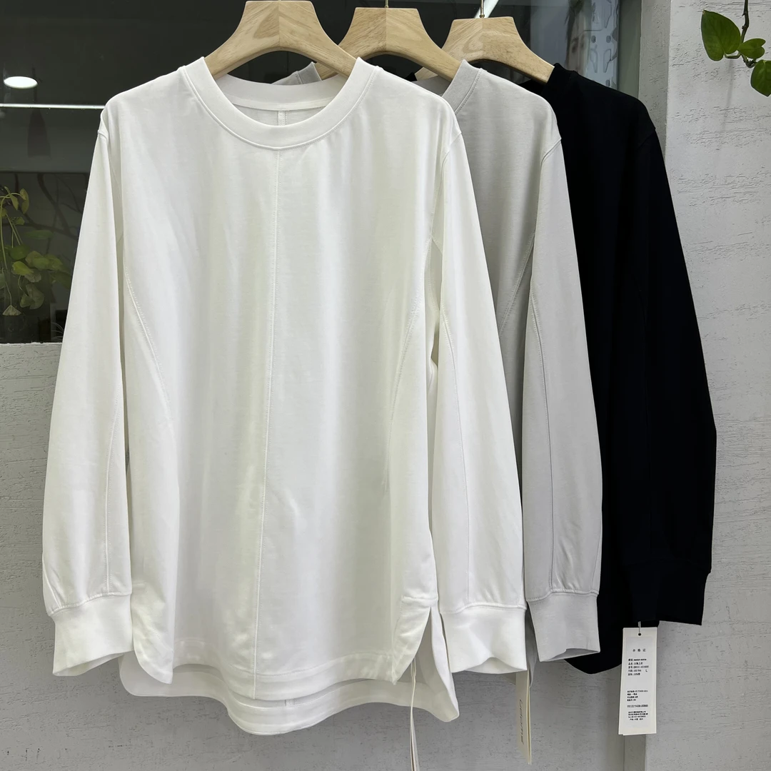 2025年早春新款简约拼接设计感显瘦宽松卫衣女百搭开叉灯笼袖上衣