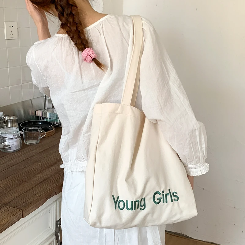 夏季字母帆布包包女2025新款潮时尚学院风托特包休闲大容量购物袋