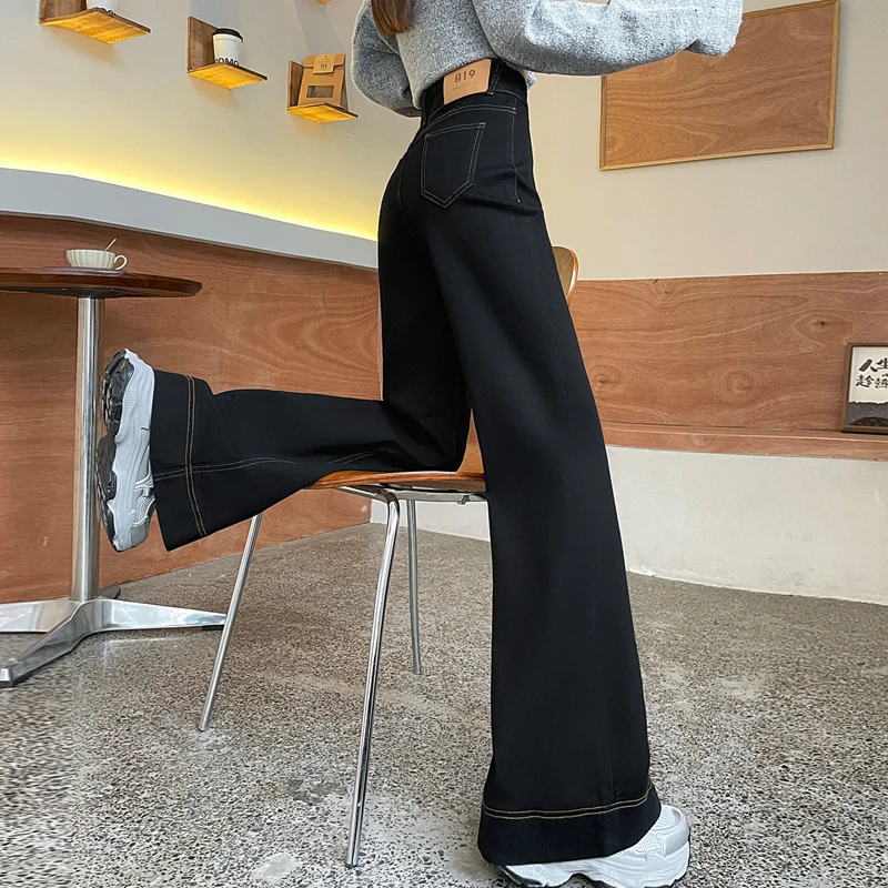 黑色阔腿时尚潮流女裤子秋冬加绒爆款2025新款百搭高腰微喇牛仔裤
