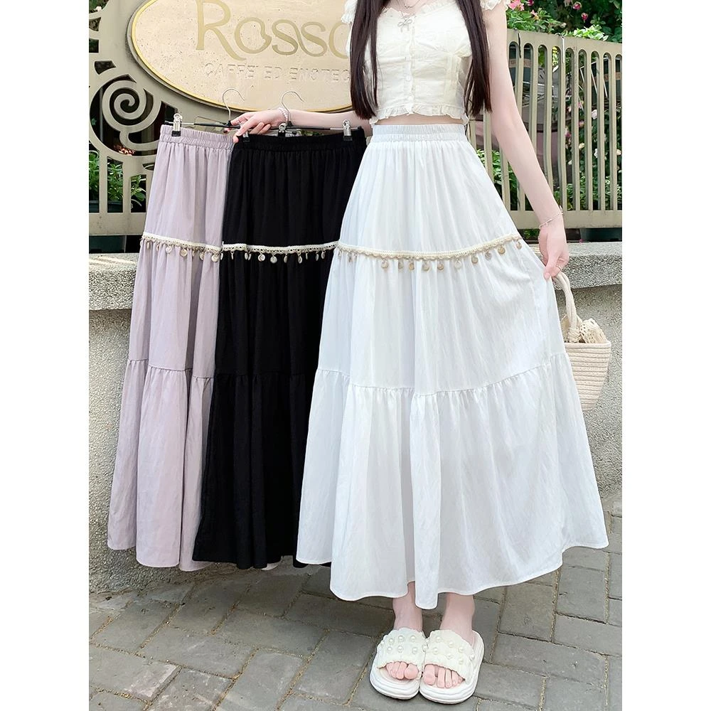 波西米亚垂感大摆半身裙夏日度假风2025新款设计感贝壳流苏a字裙