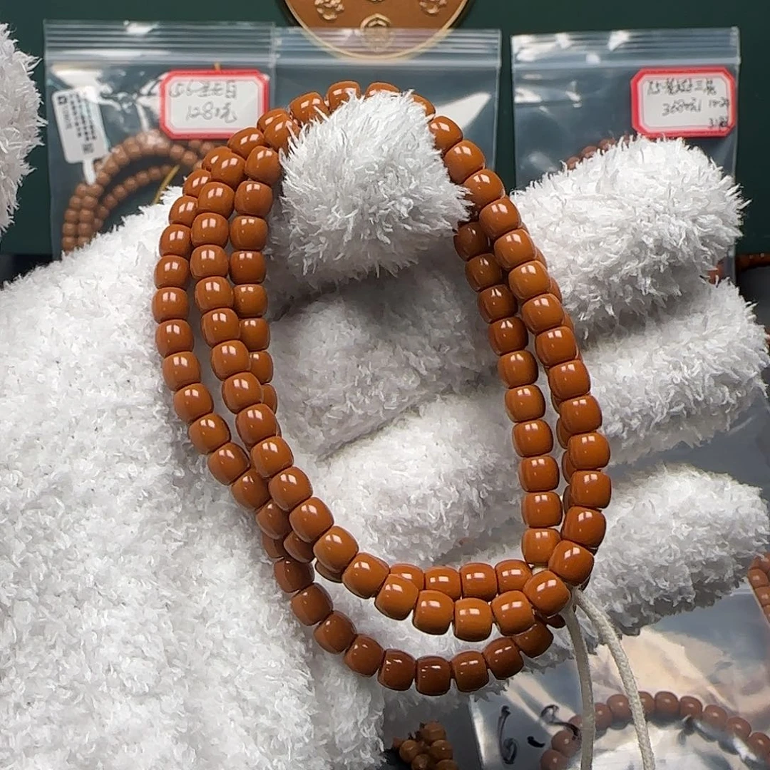 橄榄核吊坠5.7mm老挝红料高桩核尖长串毕业级无白