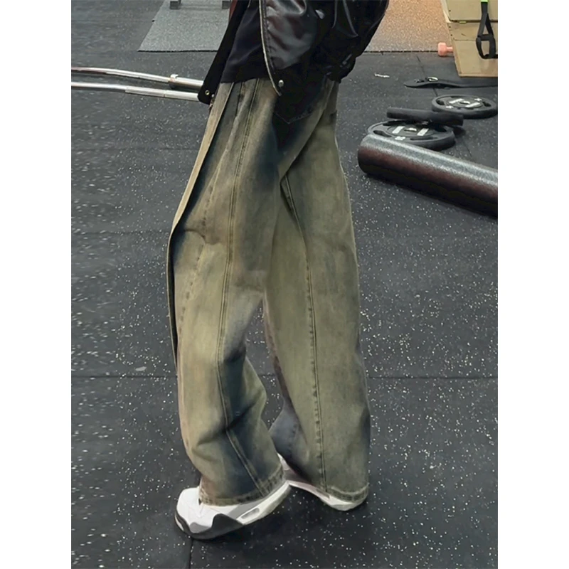 泥黄色渐变解构牛仔裤男款显瘦弯刀裤子美式高街复古微喇工装长裤