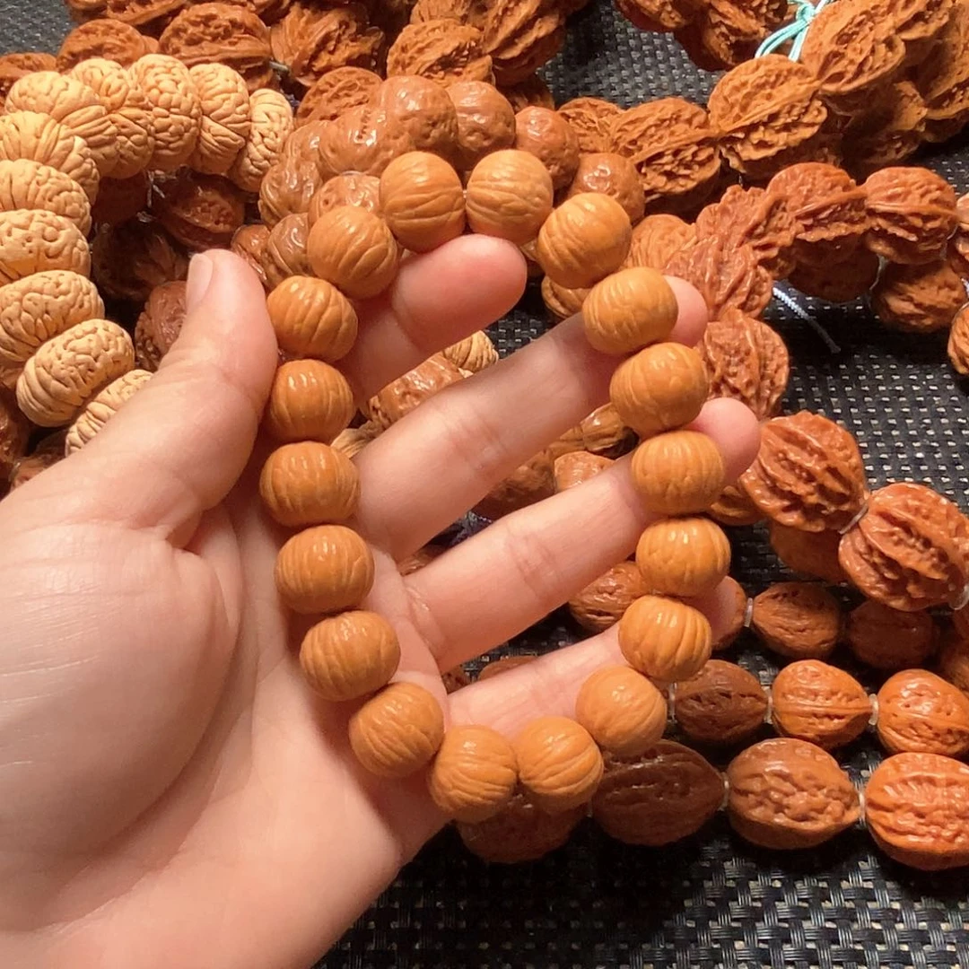 西***乐文玩核桃吊坠粗筋
