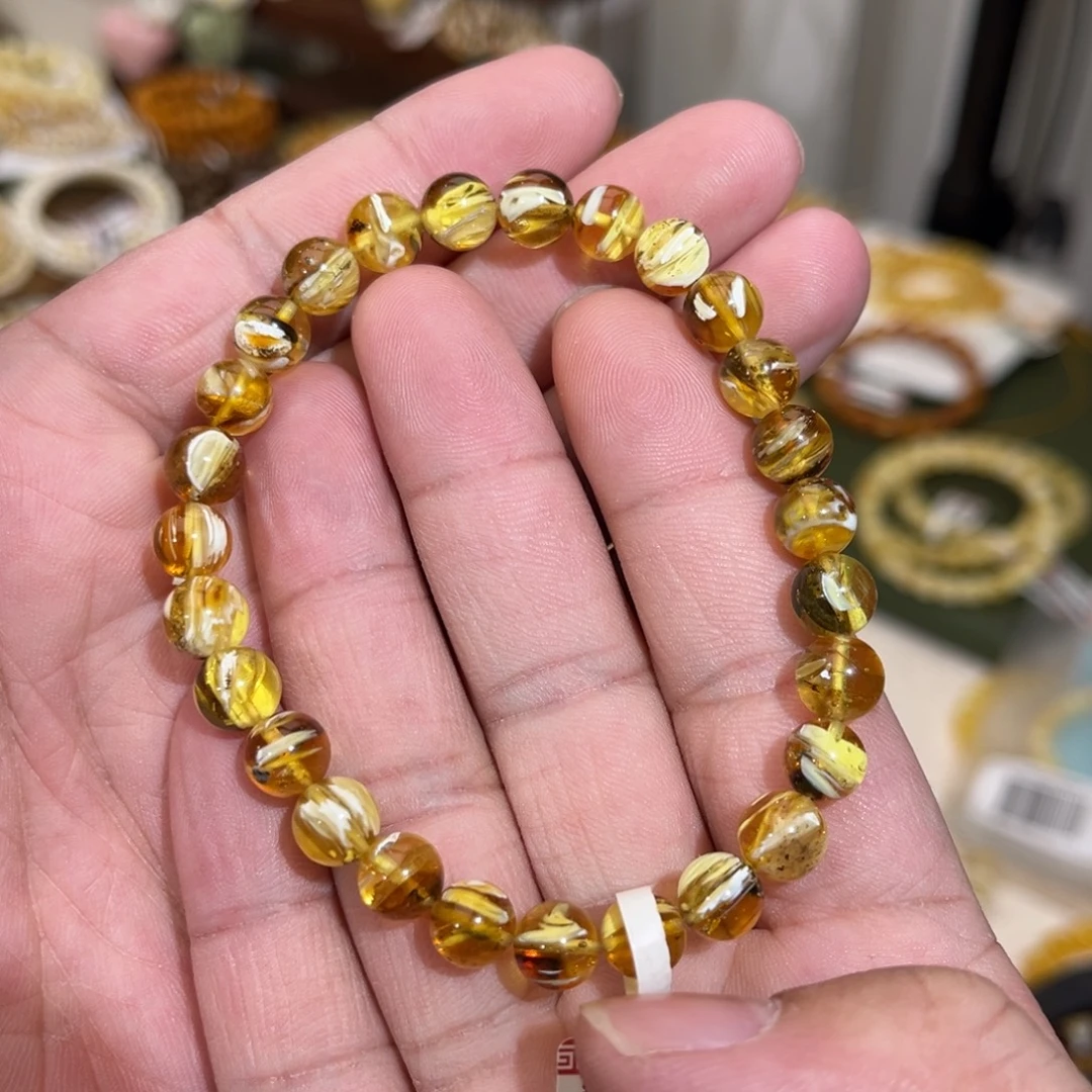 李***荔蜜蜡未镶嵌手链有瑕疵红沁拉丝纹7.5mm