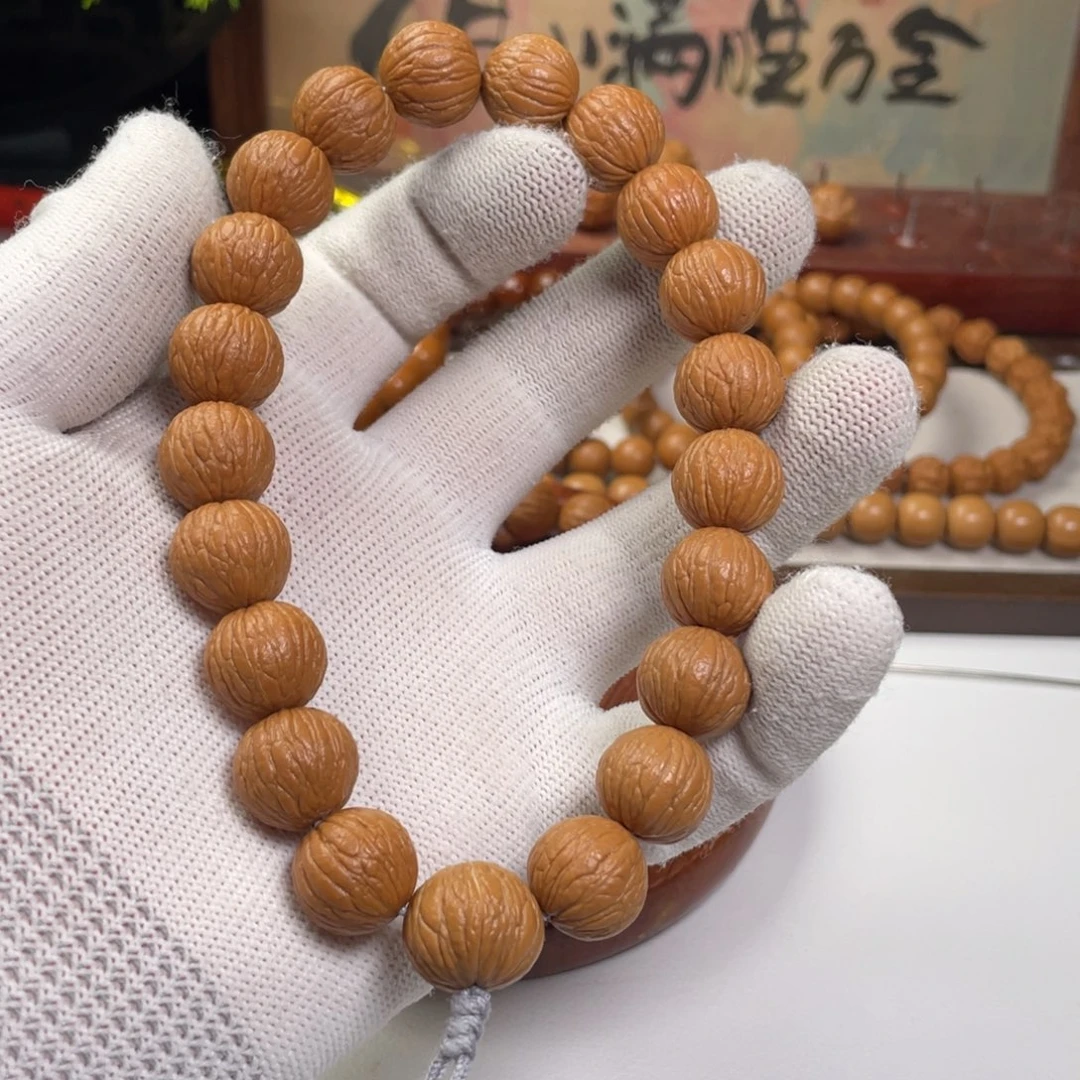 乏***丶猴头核桃手串凤羽