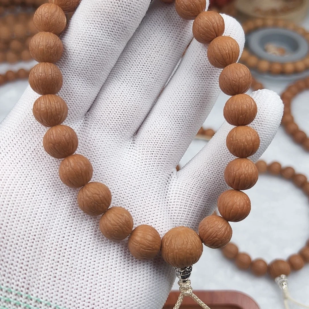 吞***兽猴头核桃手串凤羽